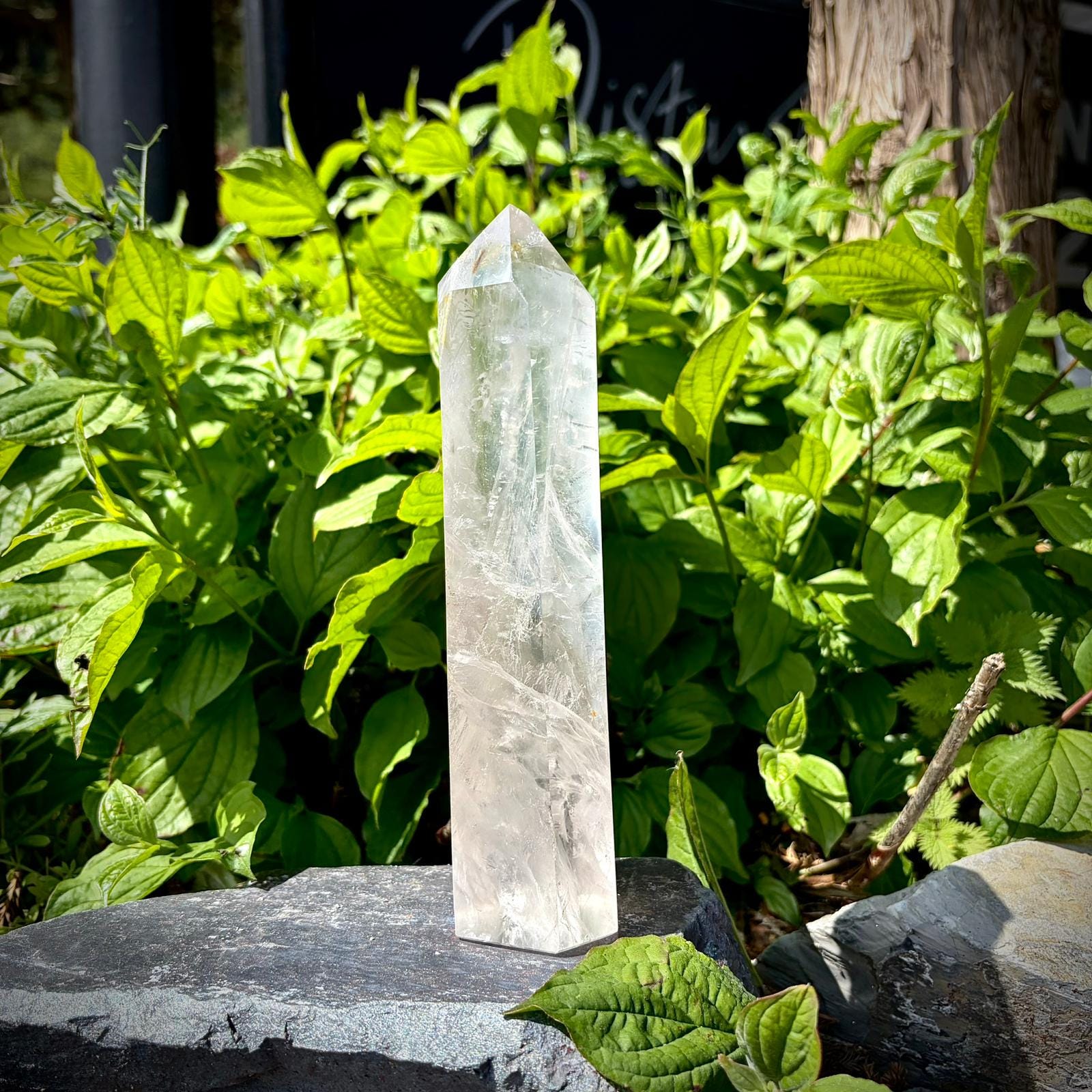 Clear quartz tower for coffee table decor with polished surface and natural internal textures.