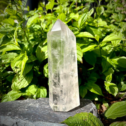 Clear quartz tower shelf decor with tall polished form and subtle natural inclusions.