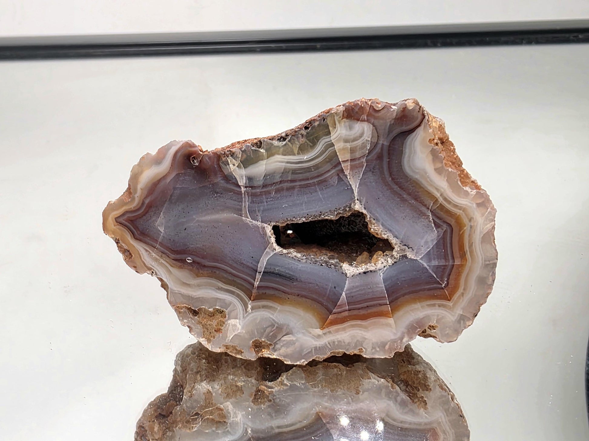 Collector natural Malawi Agate banded polished geode.