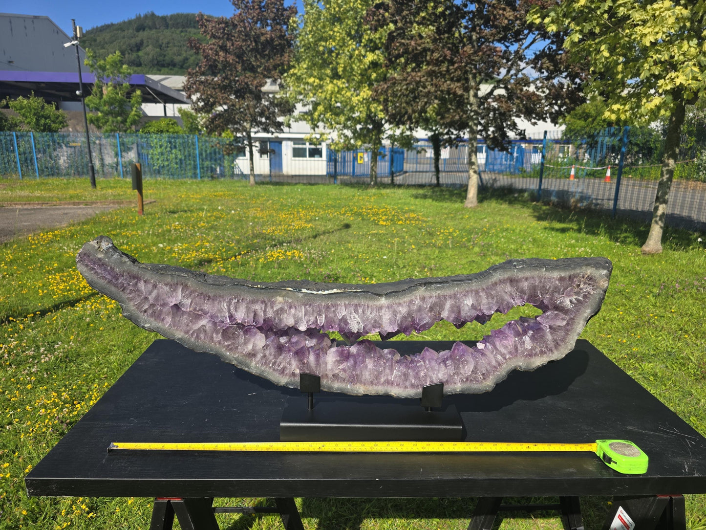 Large collector-grade amethyst portal with deep purple hue.
