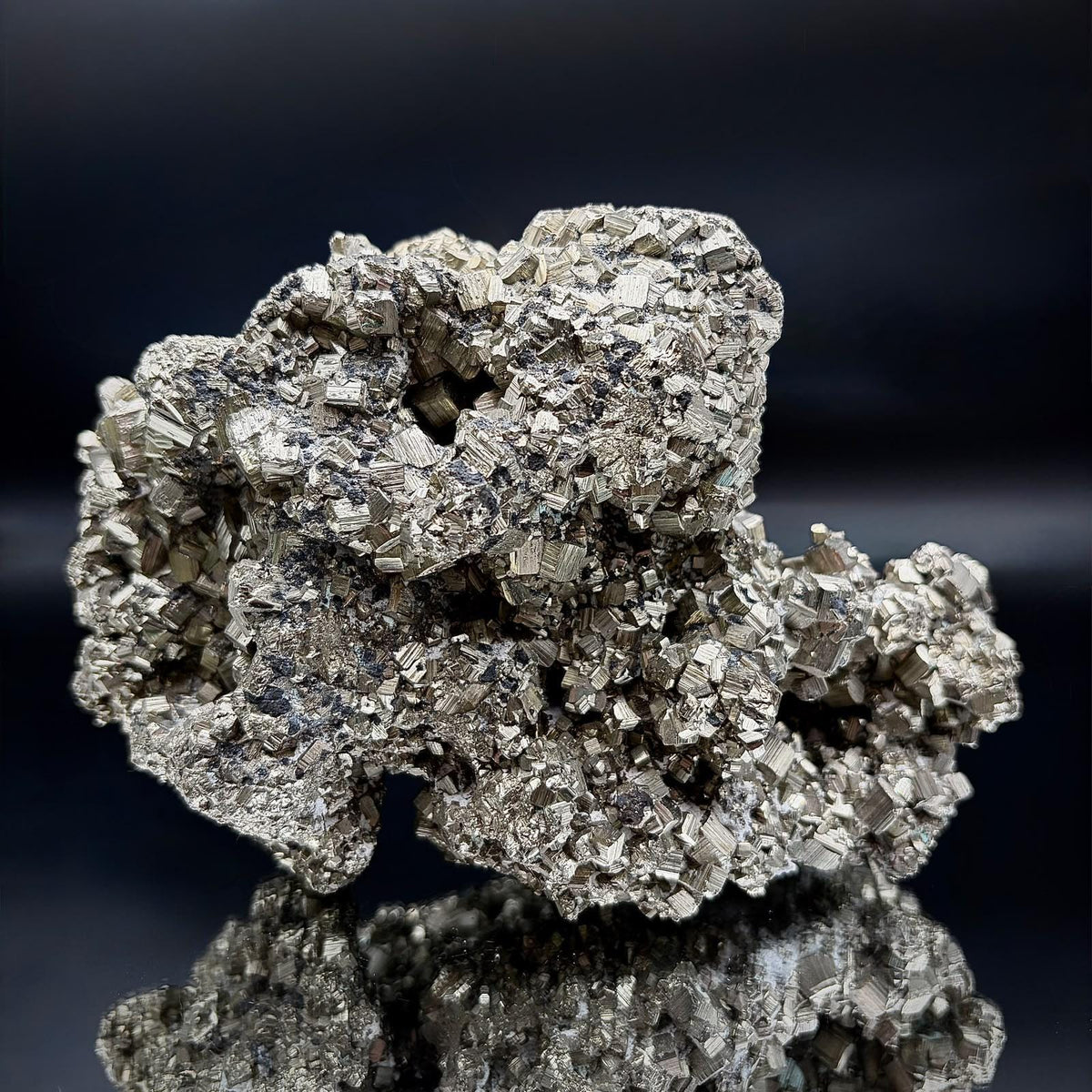 Collector-quality Pyrite crystal cluster from Peru showcasing its natural crystal arrangement and metallic appearance.