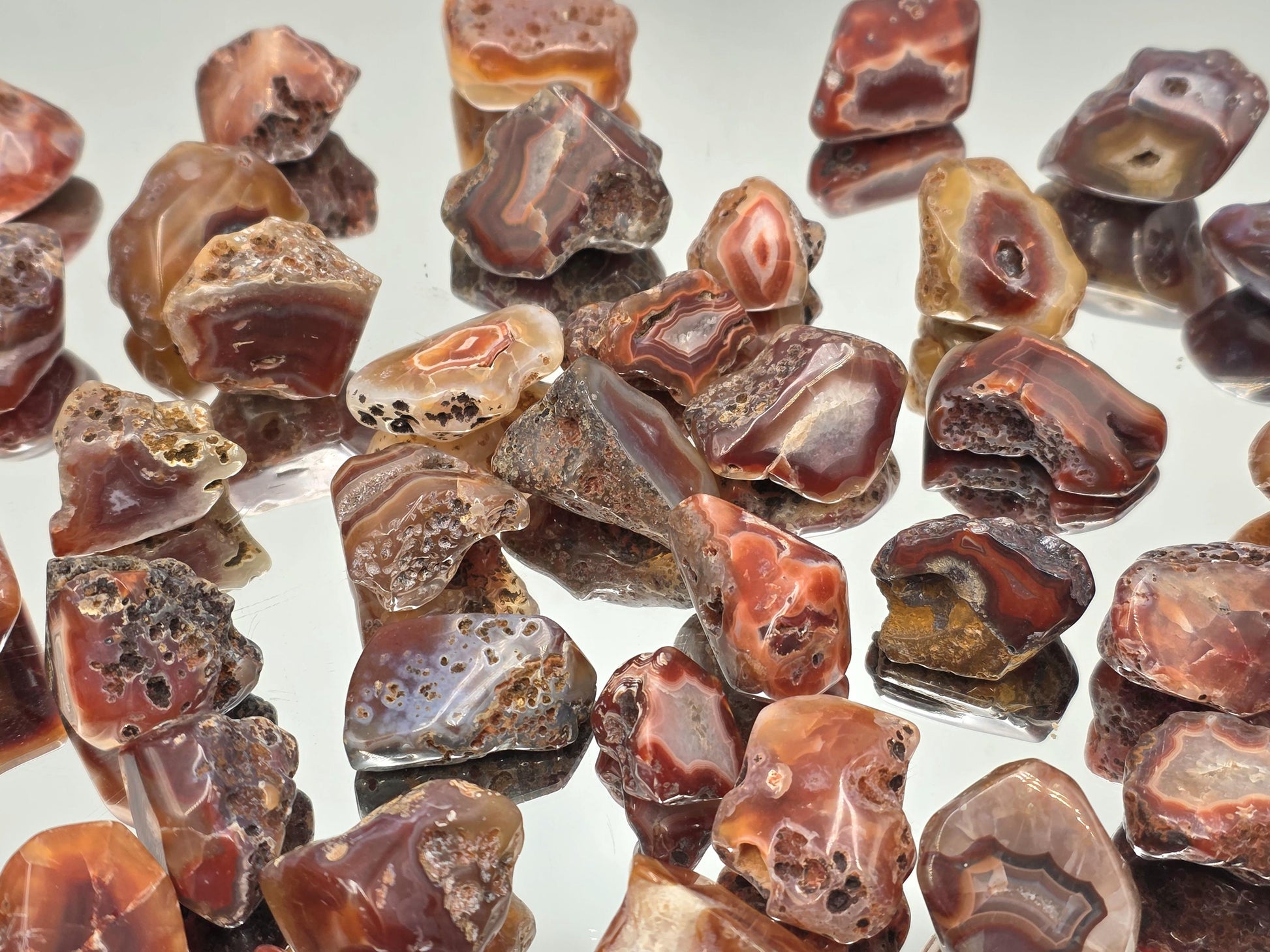 Colourful Malawi Agate tumblestone featuring layered natural bands and smooth polish.