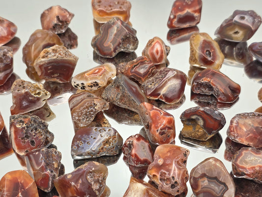 Colourful Malawi Agate tumblestone featuring layered natural bands and smooth polish.