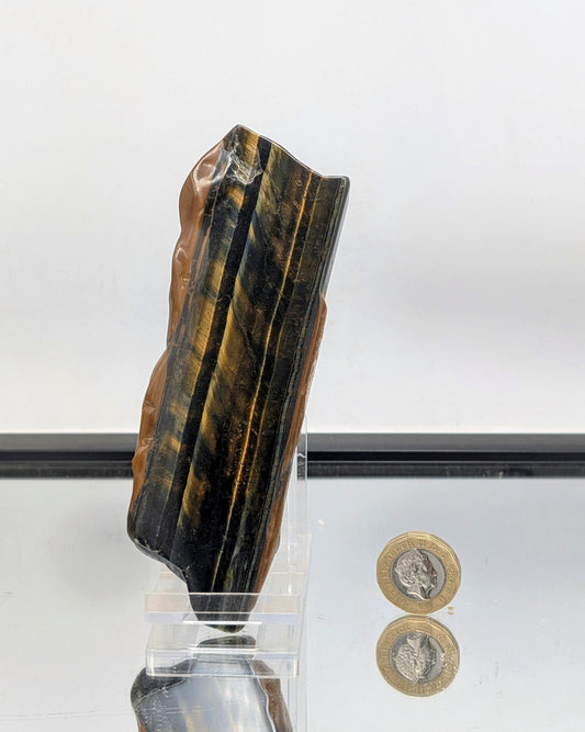 Display-ready Tiger’s Eye crystal slice with natural banding.