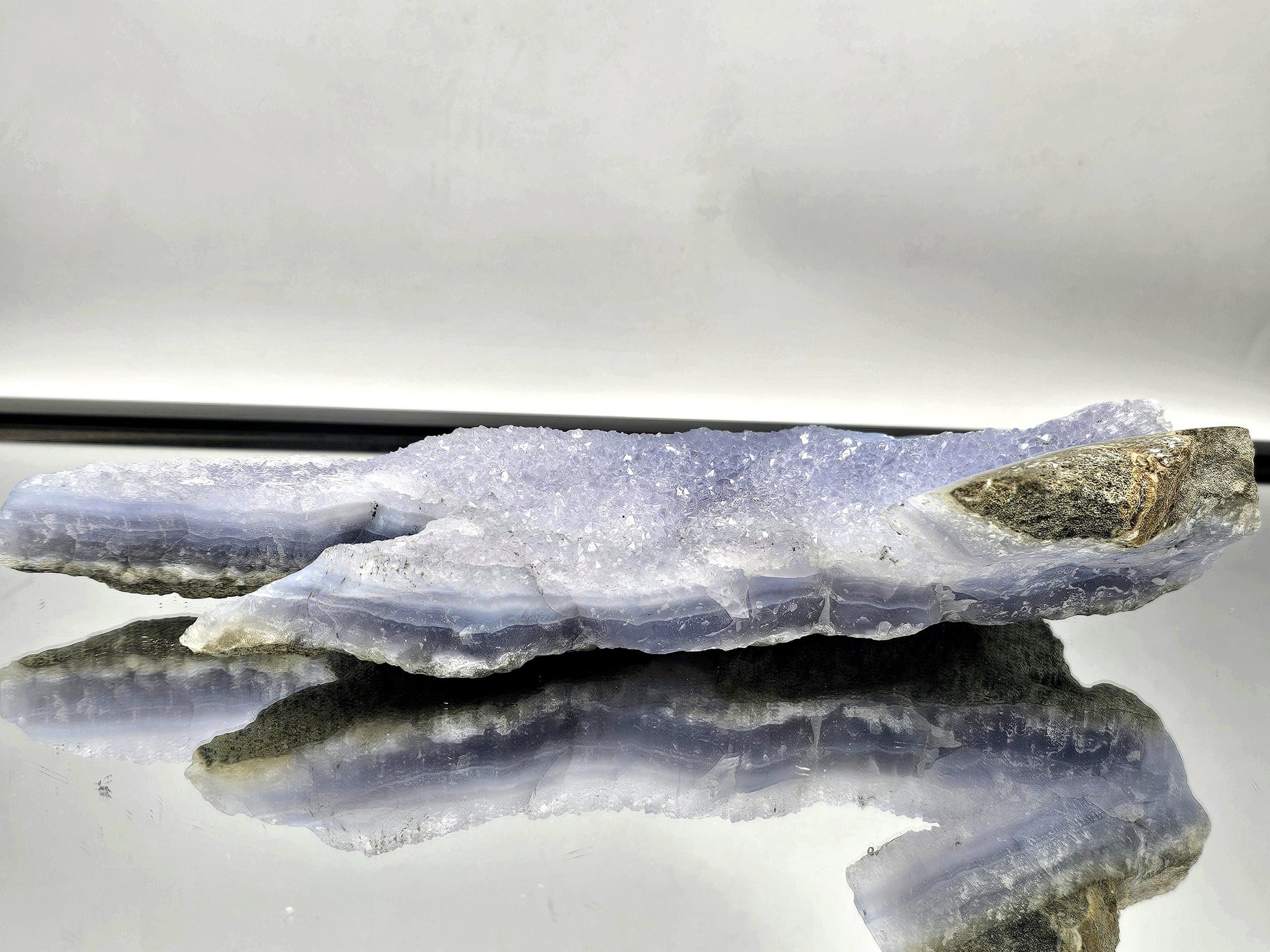 Blue Lace Agate geode as a centerpiece in modern home decor, blending natural beauty with elegance.