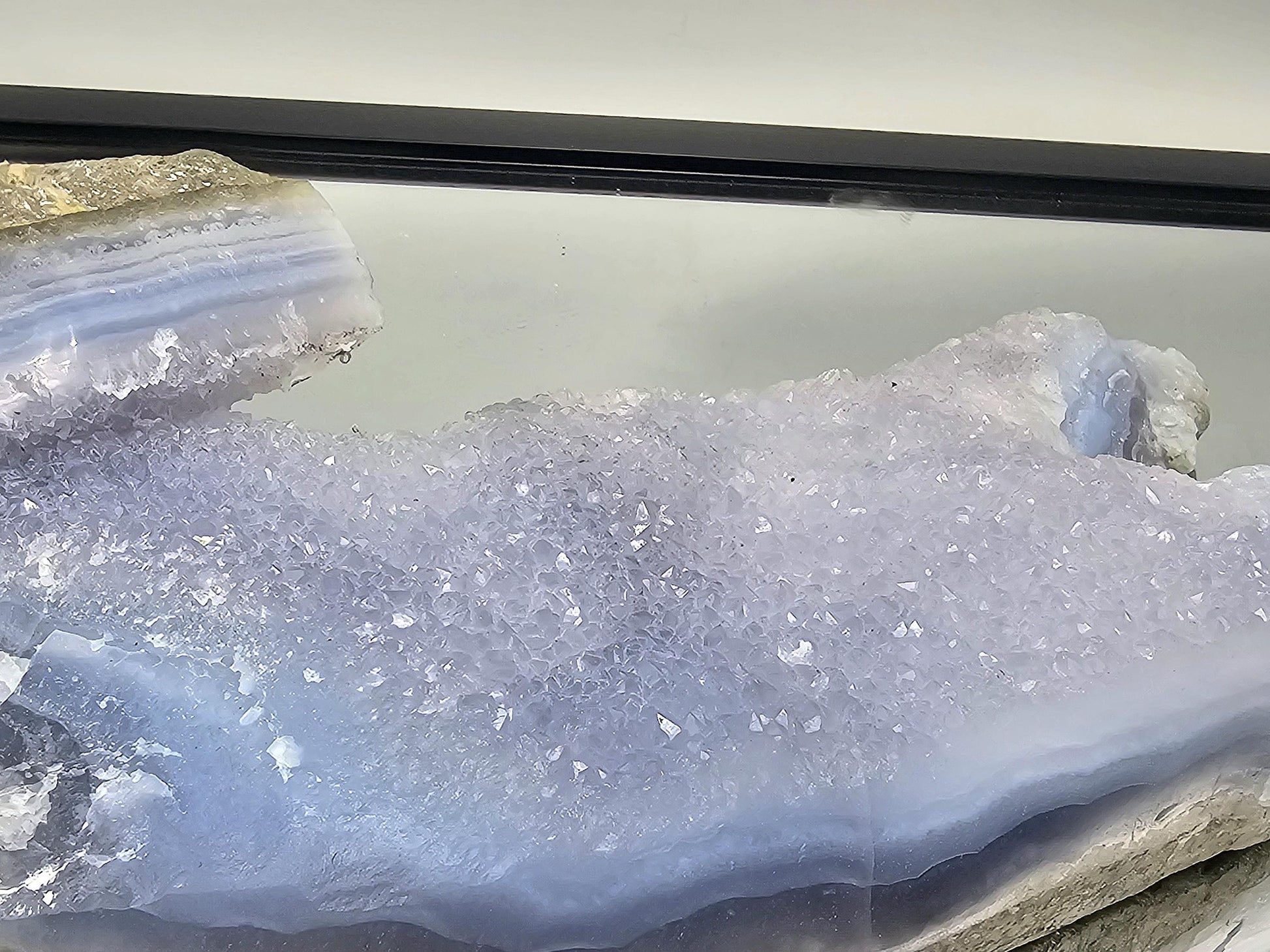 Blue Lace Agate geode used as a centerpiece in a modern home decor setting.
