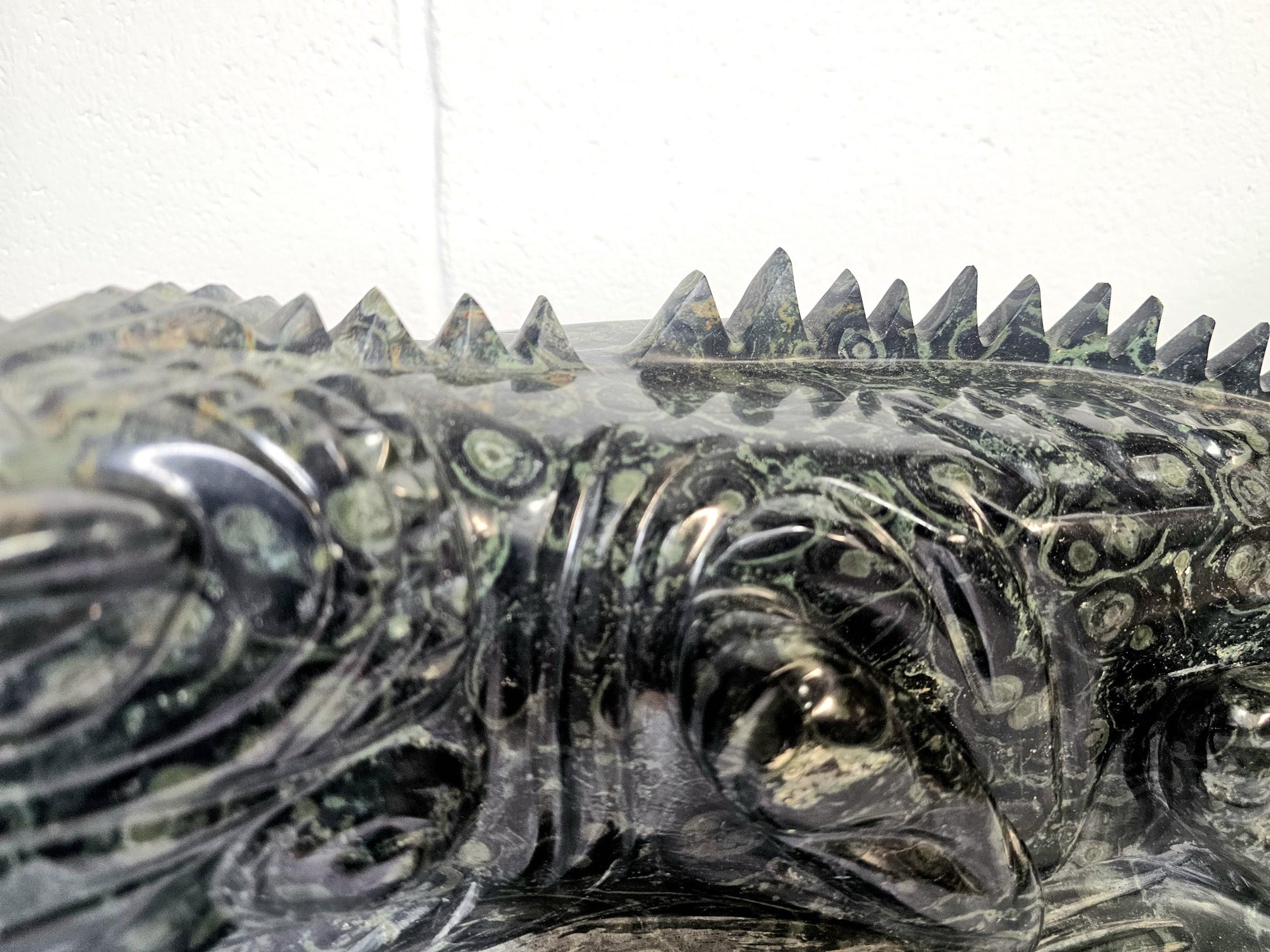 Intricately detailed Jasper Iguana carving, perfect for display.