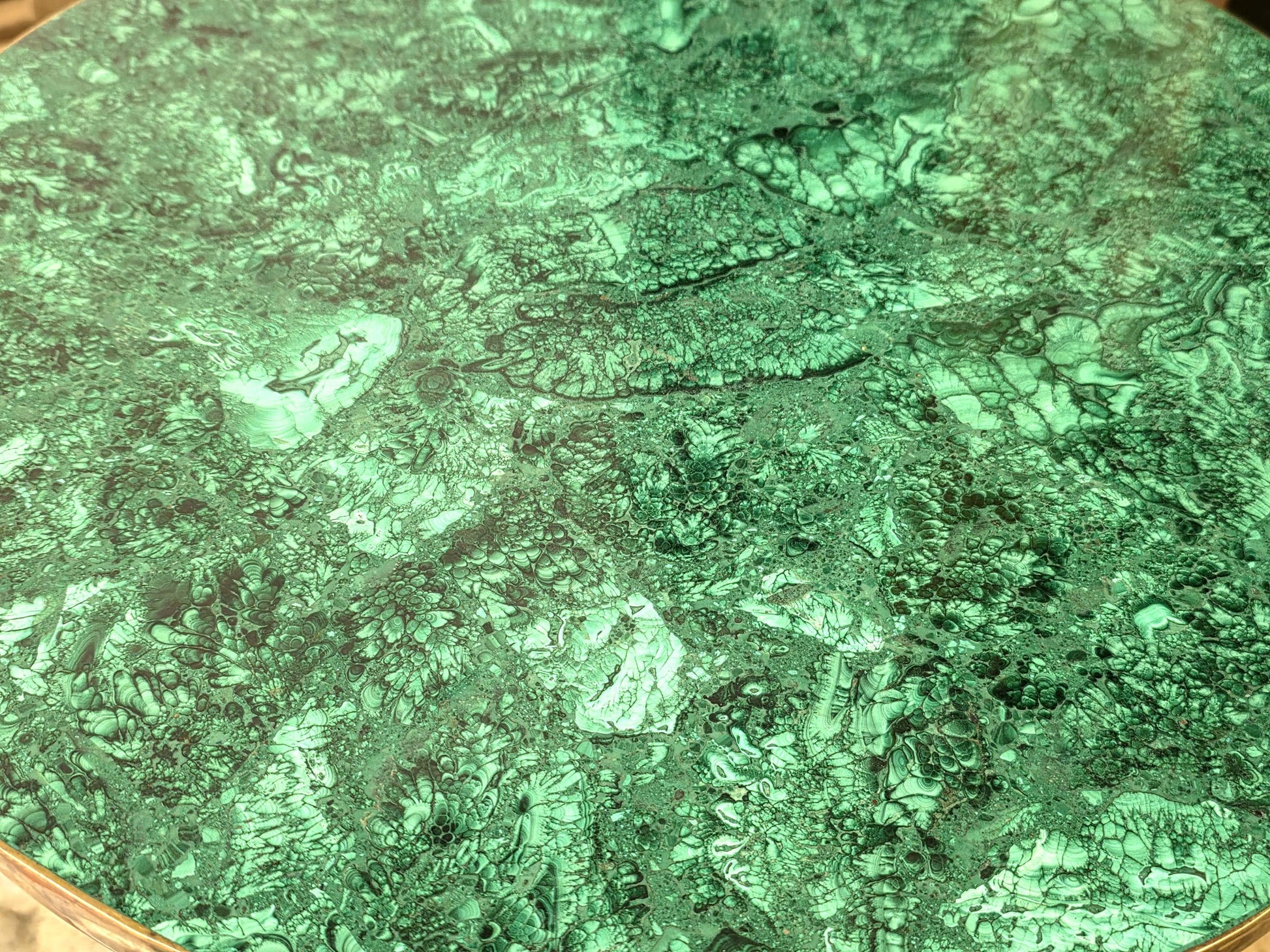 Interior decor crystal table with rich malachite textures and unique natural banding.