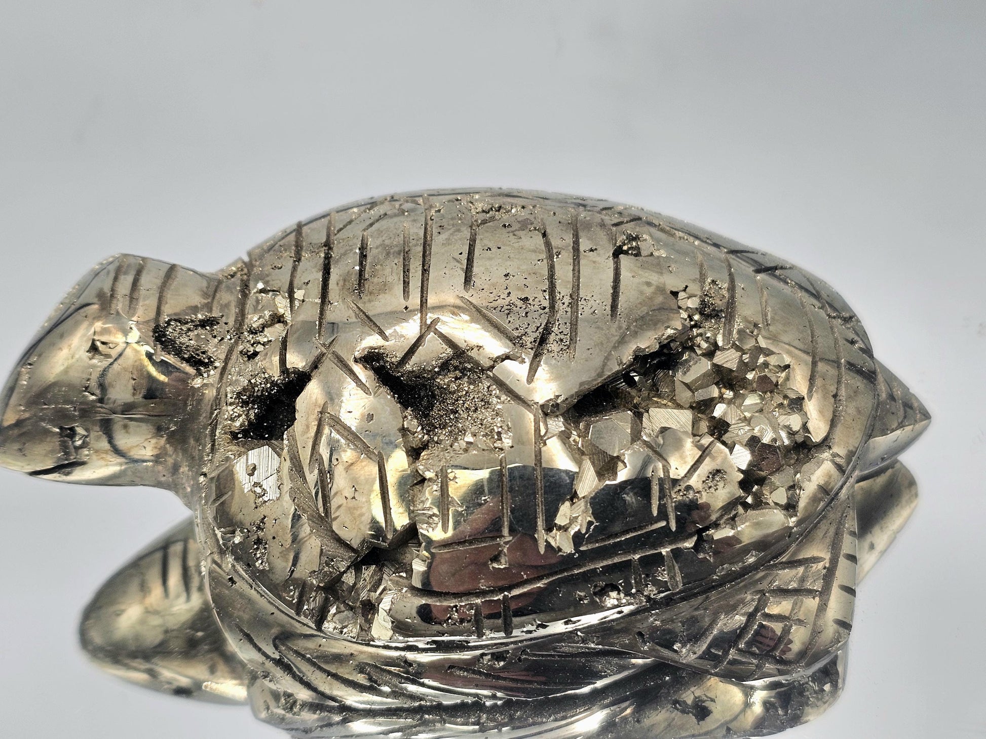 Luxury home decor featuring a Pyrite Turtle Carving from Peru.