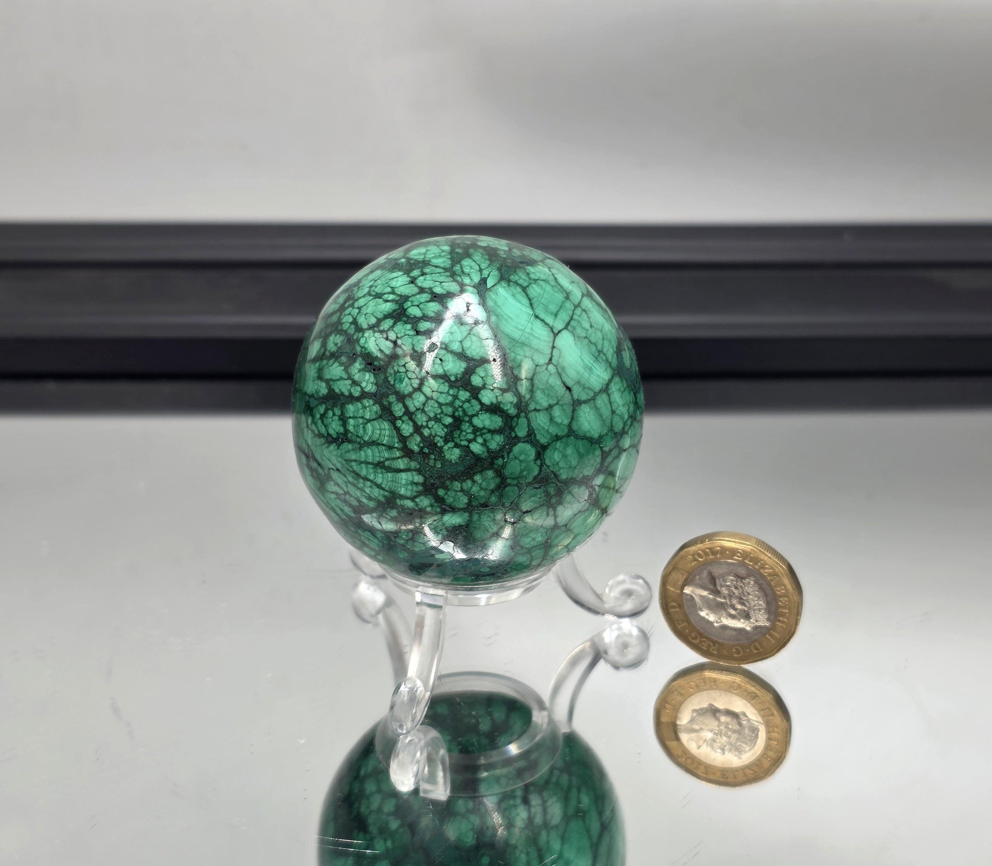 Decorative malachite sphere for stylish interiors.