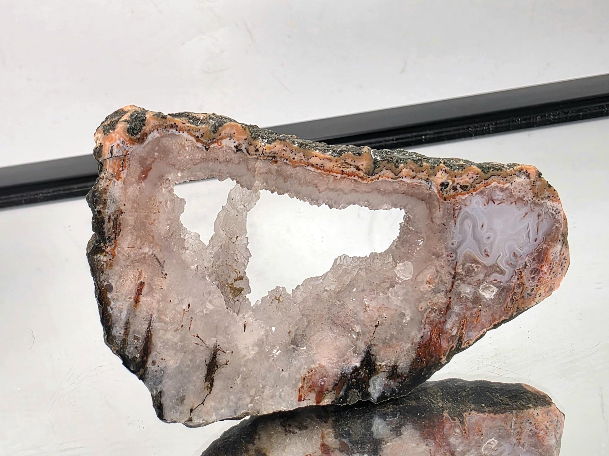Decorative Moroccan Pink Agate slice polished for display.