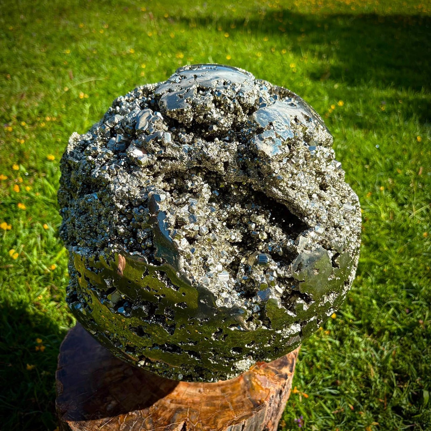 Designer mineral sculpture featuring a large polished Peruvian Pyrite sphere.