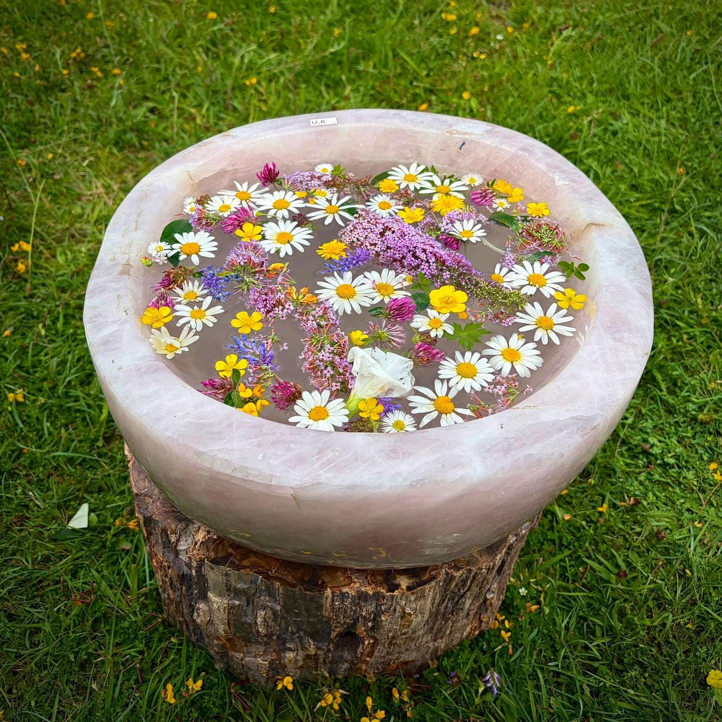 Designer Madagascan Rose Quartz crystal bowl used as an elegant centrepiece for a refined interior.