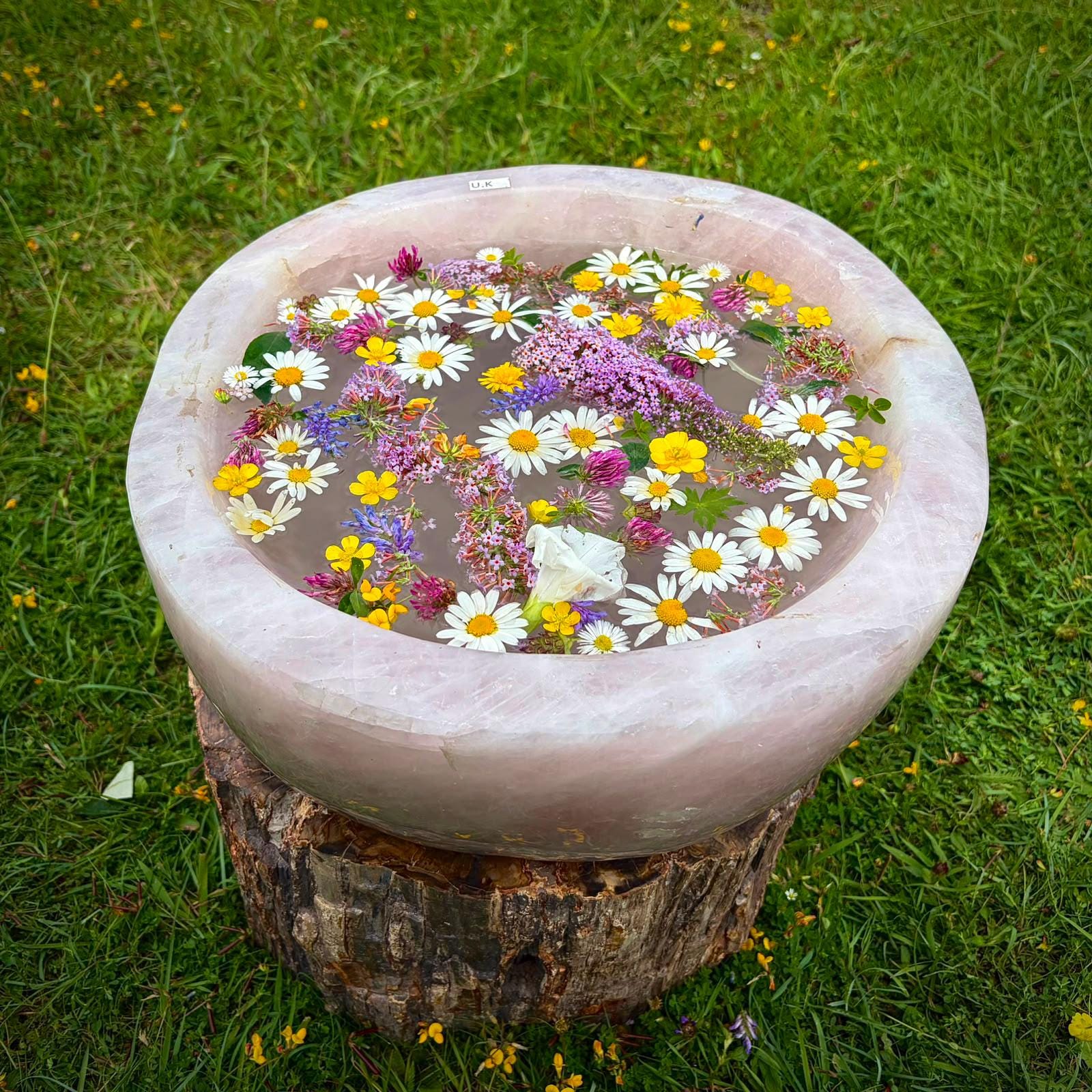 Designer Madagascan Rose Quartz crystal bowl used as an elegant centrepiece for a refined interior.
