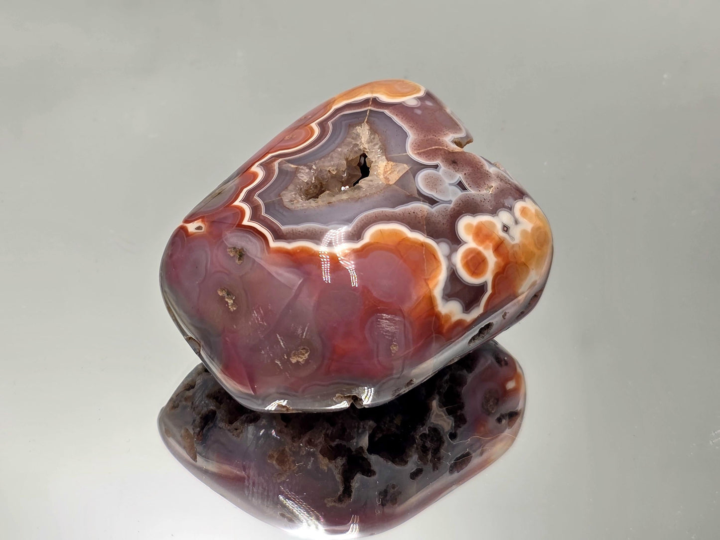 Display Malawi Agate polished crystal geode.