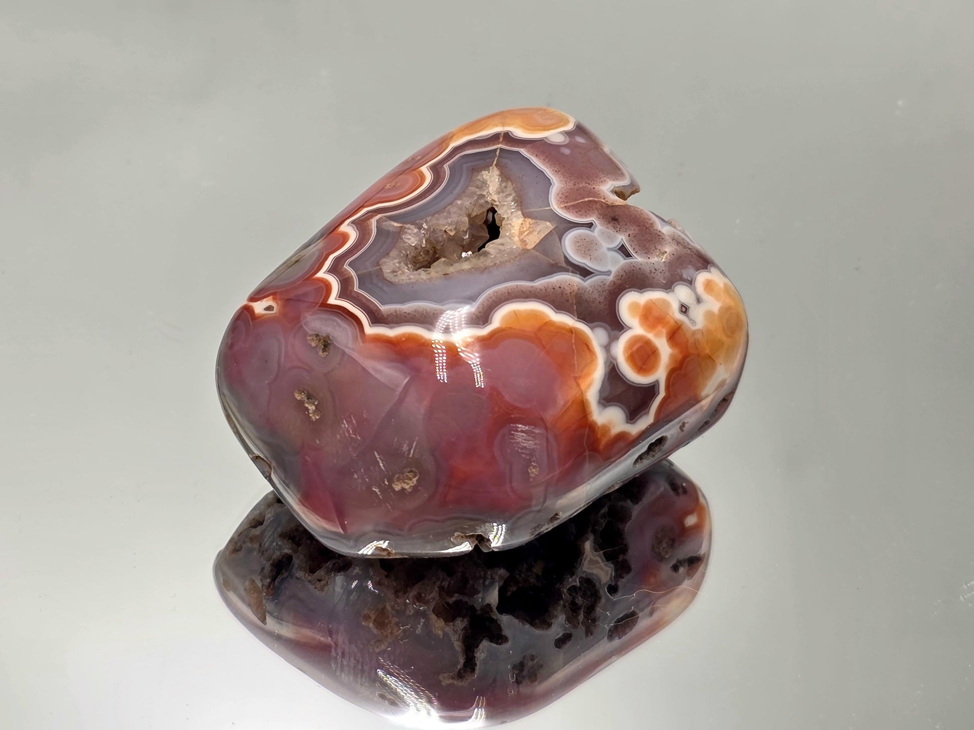 Display Malawi Agate polished crystal geode.