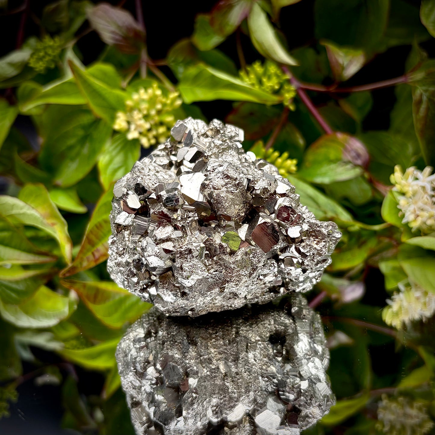 Front view of a large Pyrite cluster highlighting its bright metallic lustre and dimensions.