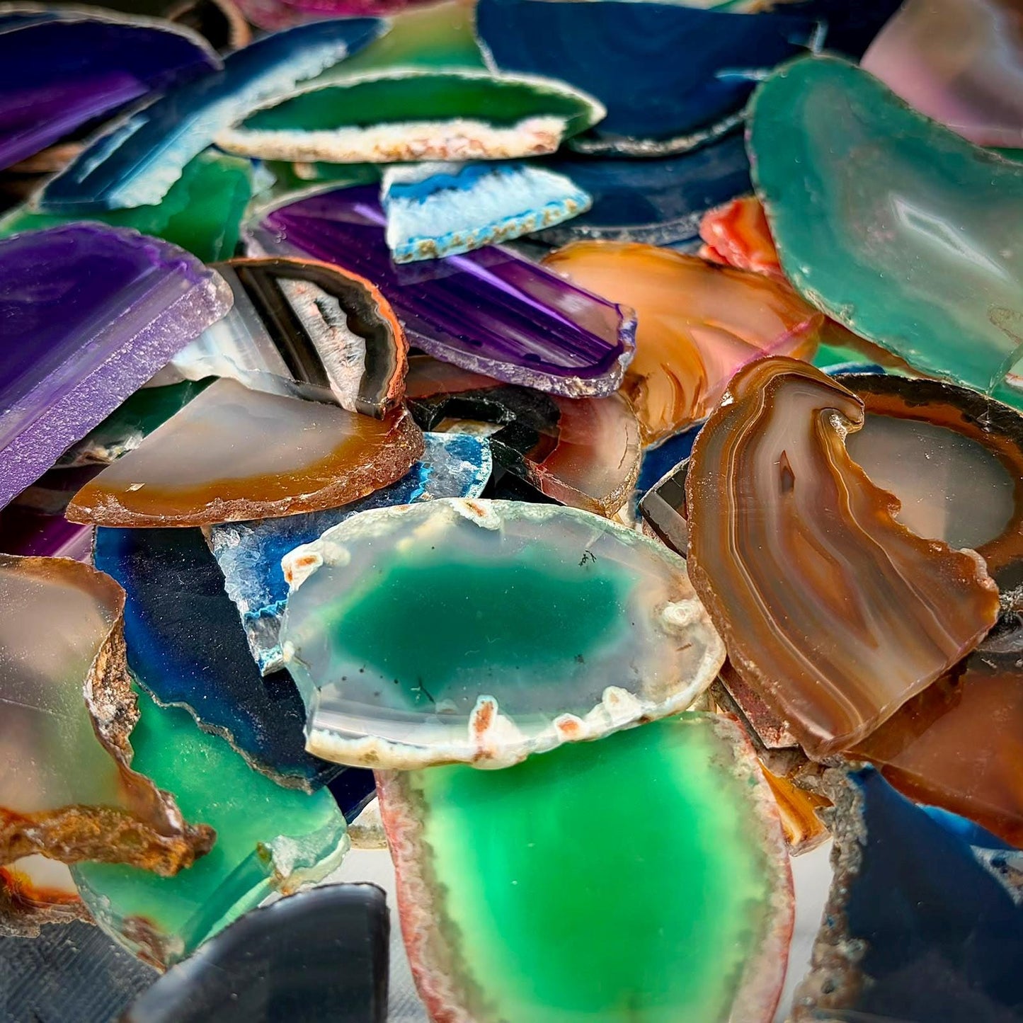 Colourful broken dyed agate slices ideal for resin art, geode-inspired designs and handmade craft projects.