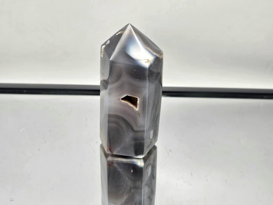 Elegant Orca Agate crystal point, perfect for energy healing.
