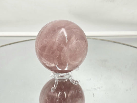 Exceptional star rose quartz crystal sphere with deep pink tones