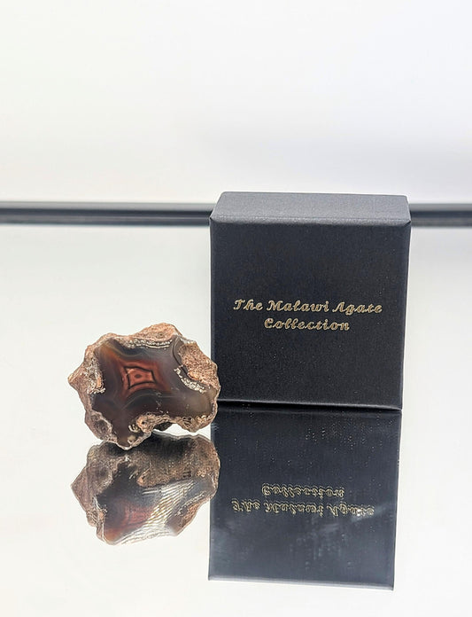 Exclusive Malawi Agate collection featuring naturally banded, polished stones.