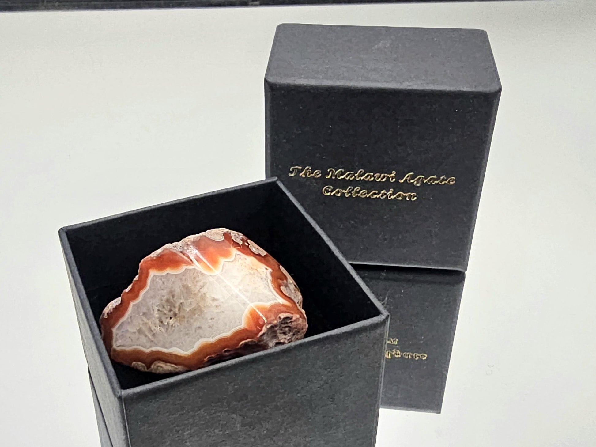 Exclusive Malawi agate collection piece, polished and displayed in a luxury box.
