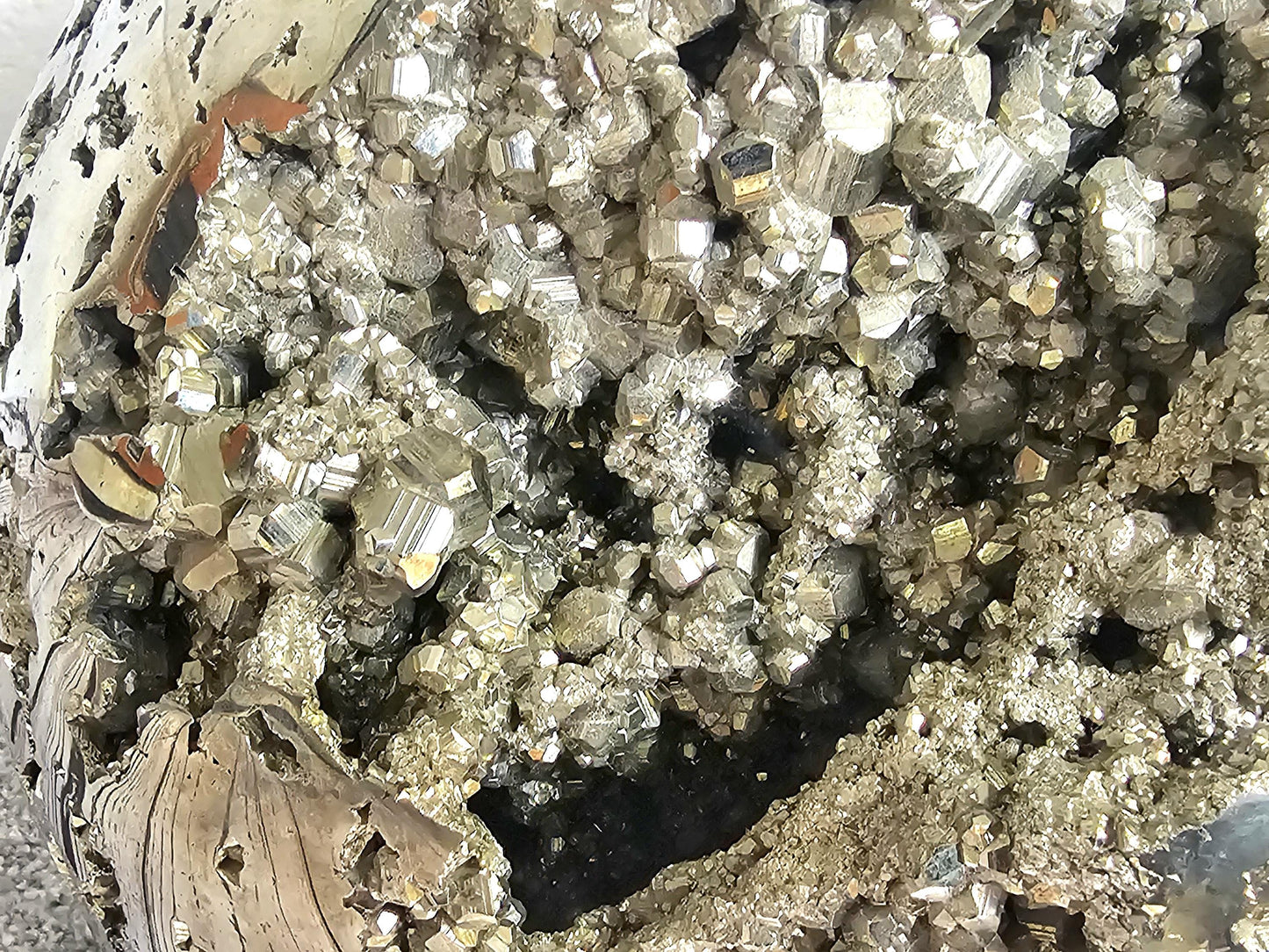 Natural polished pyrite crystal sphere, ideal for decor.