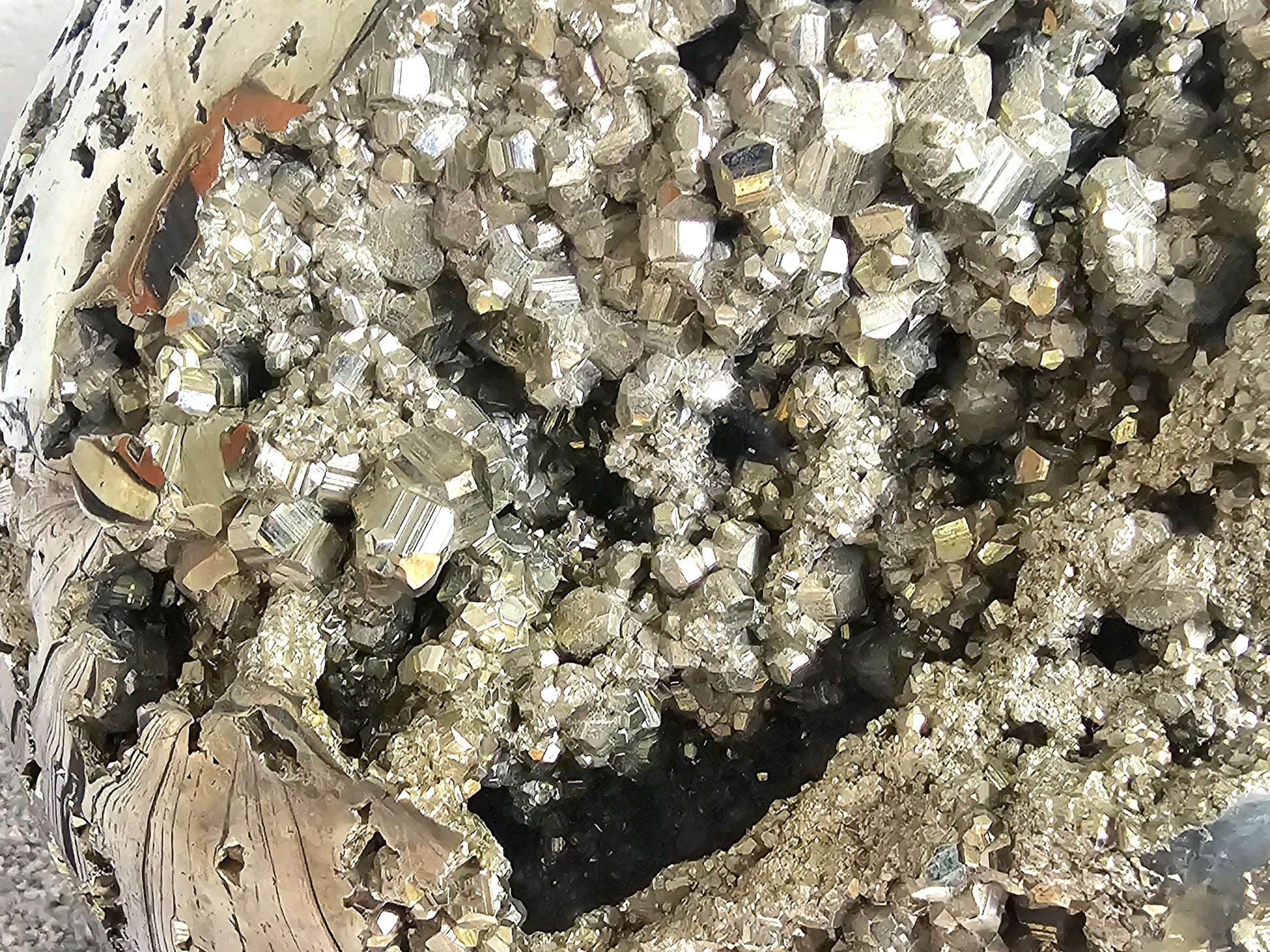 Natural polished pyrite crystal sphere, ideal for decor.