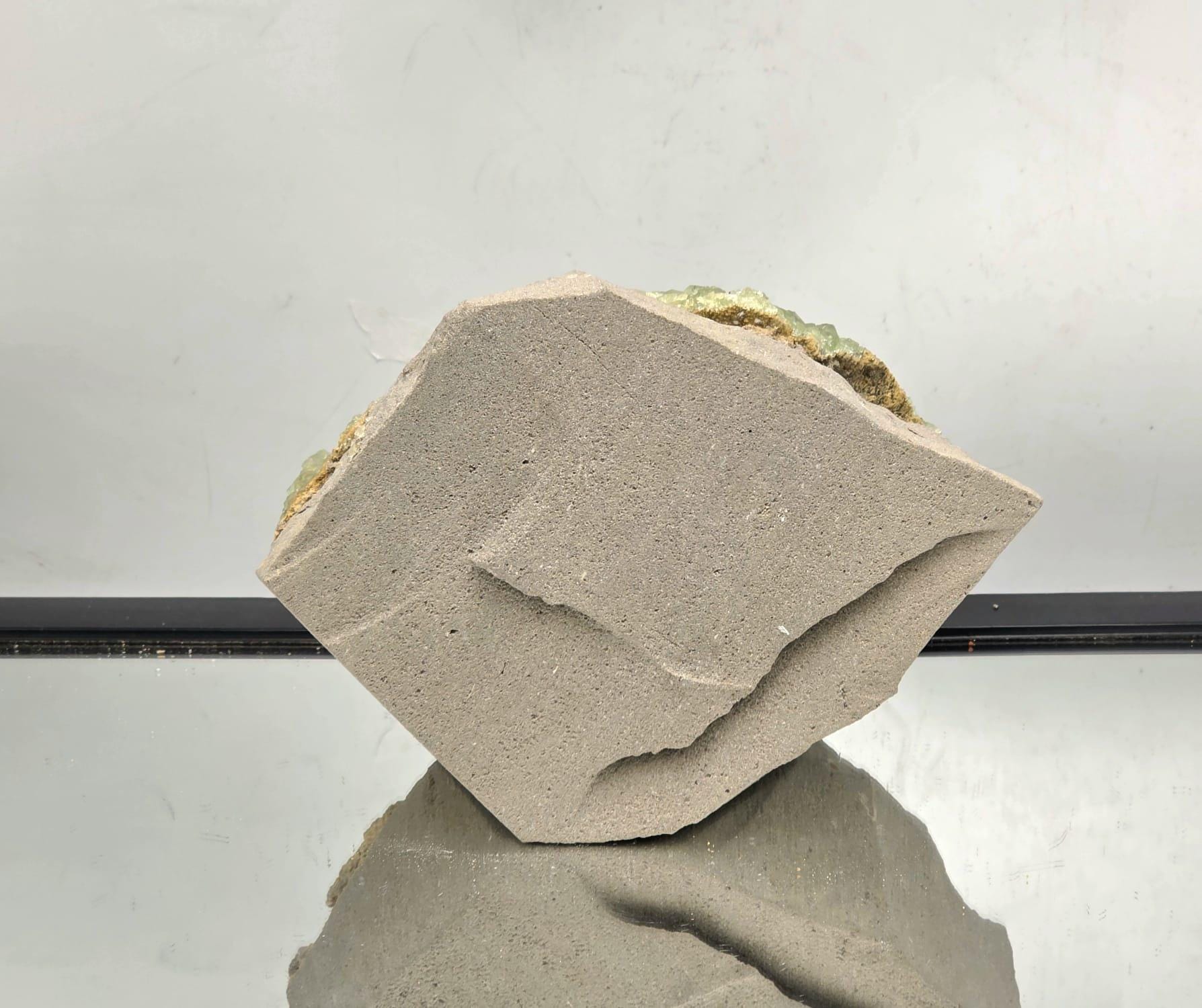 Large cabinet-size fluorite specimen with glassy green crystals.