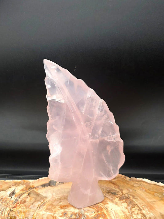 Freestanding Rose Quartz crystal leaf sculpture hand carved and polished in Madagascar.