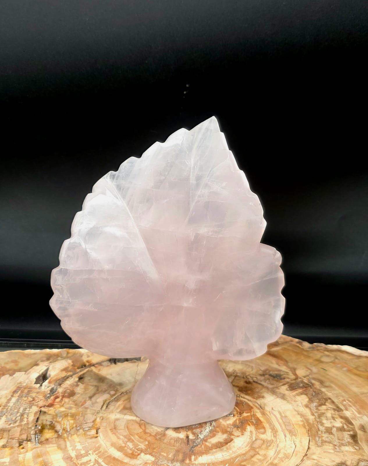 Genuine Rose Quartz leaf sculpture displaying natural blush tones.