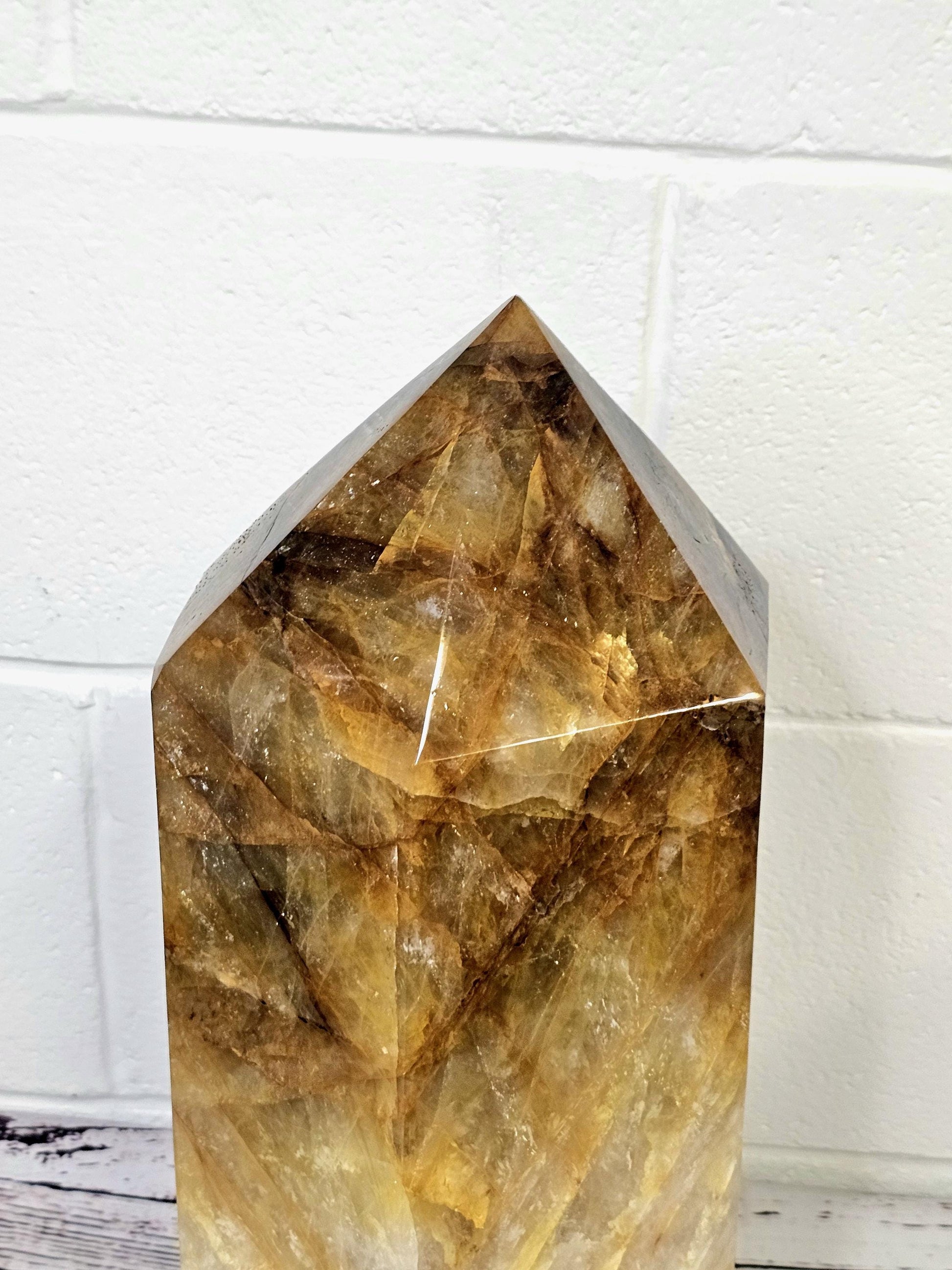 Golden Healer Crystal Prism showcasing vibrant yellow and gold hues.