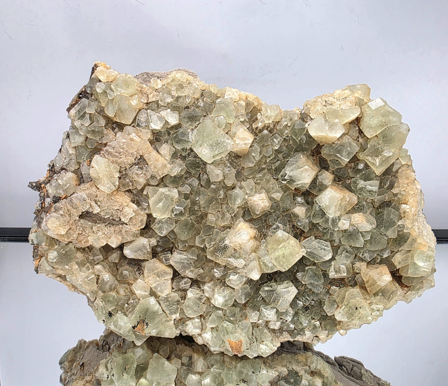 Rare octahedral fluorite specimen with sharp crystal formations and glassy luster.