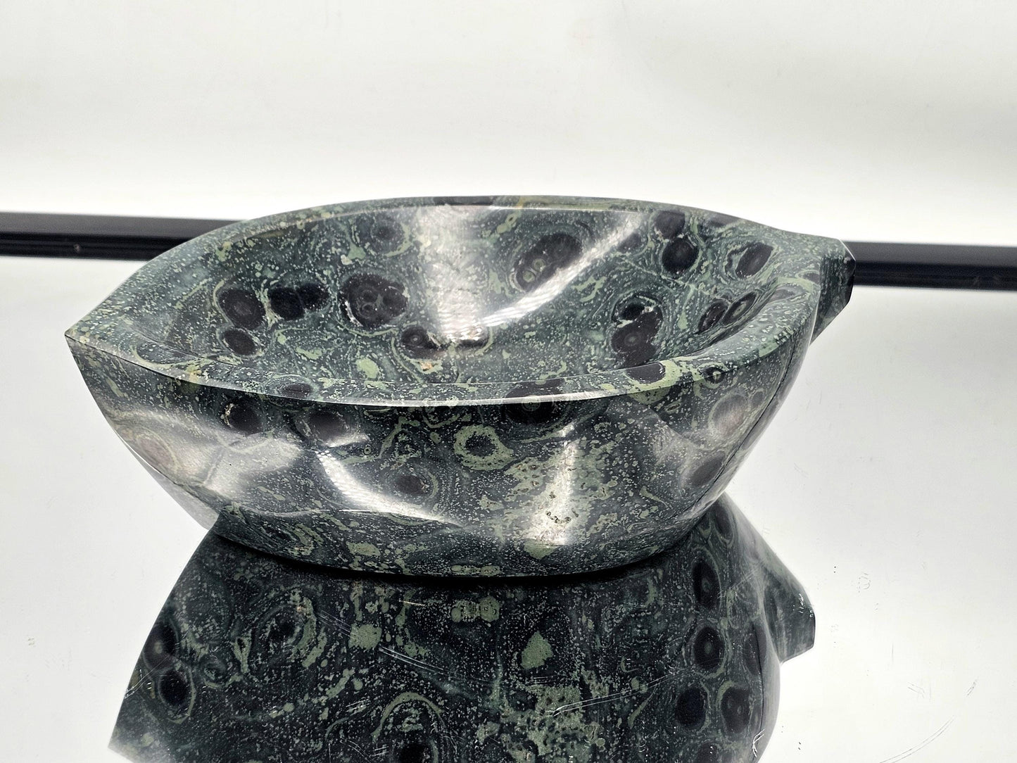 Handcrafted Kambaba Jasper bowl with vibrant green patterns.