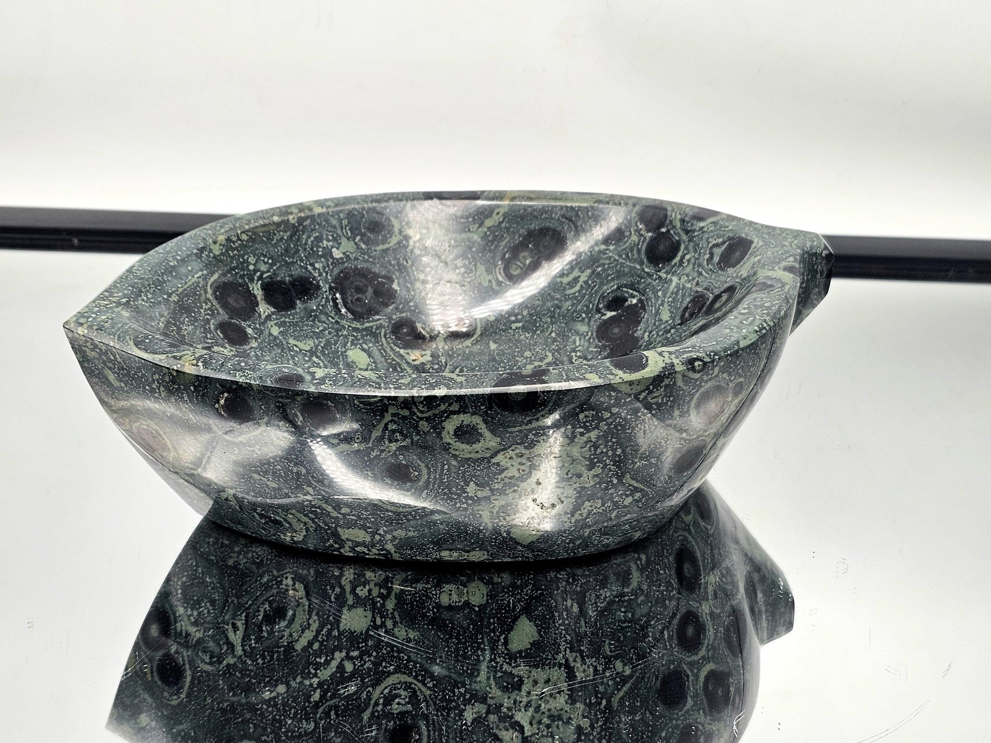 Handcrafted Kambaba Jasper bowl with vibrant green patterns.
