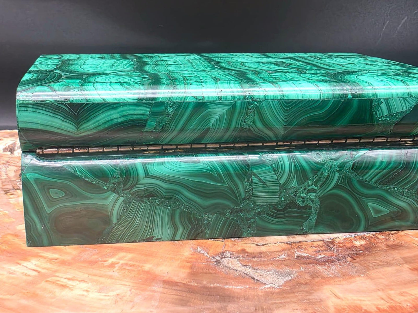 Decorative Malachite storage box displaying rich green tones and intricate banding.