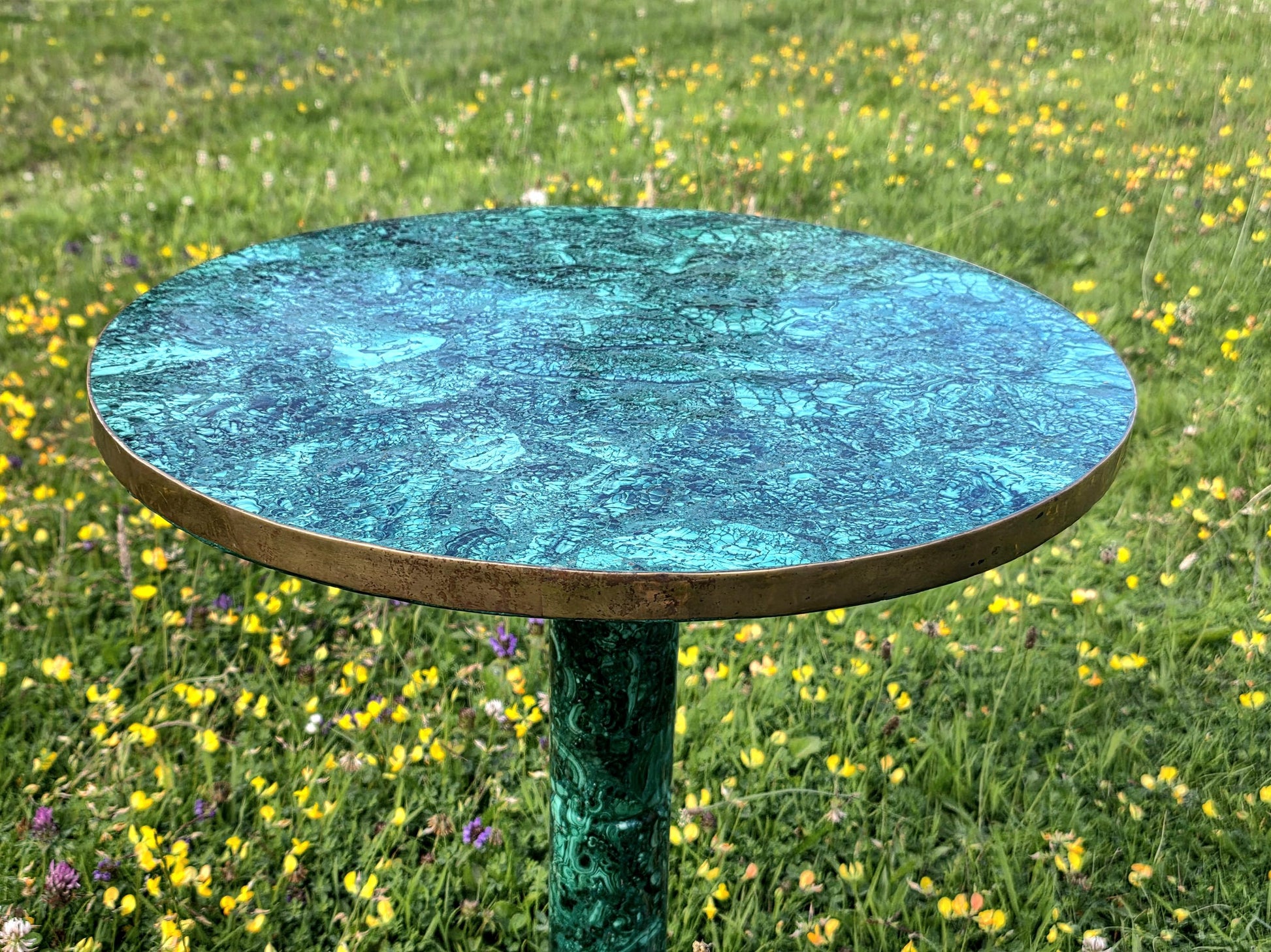 Stunning round tabletop with genuine green malachite inlay and botanical banding patterns.