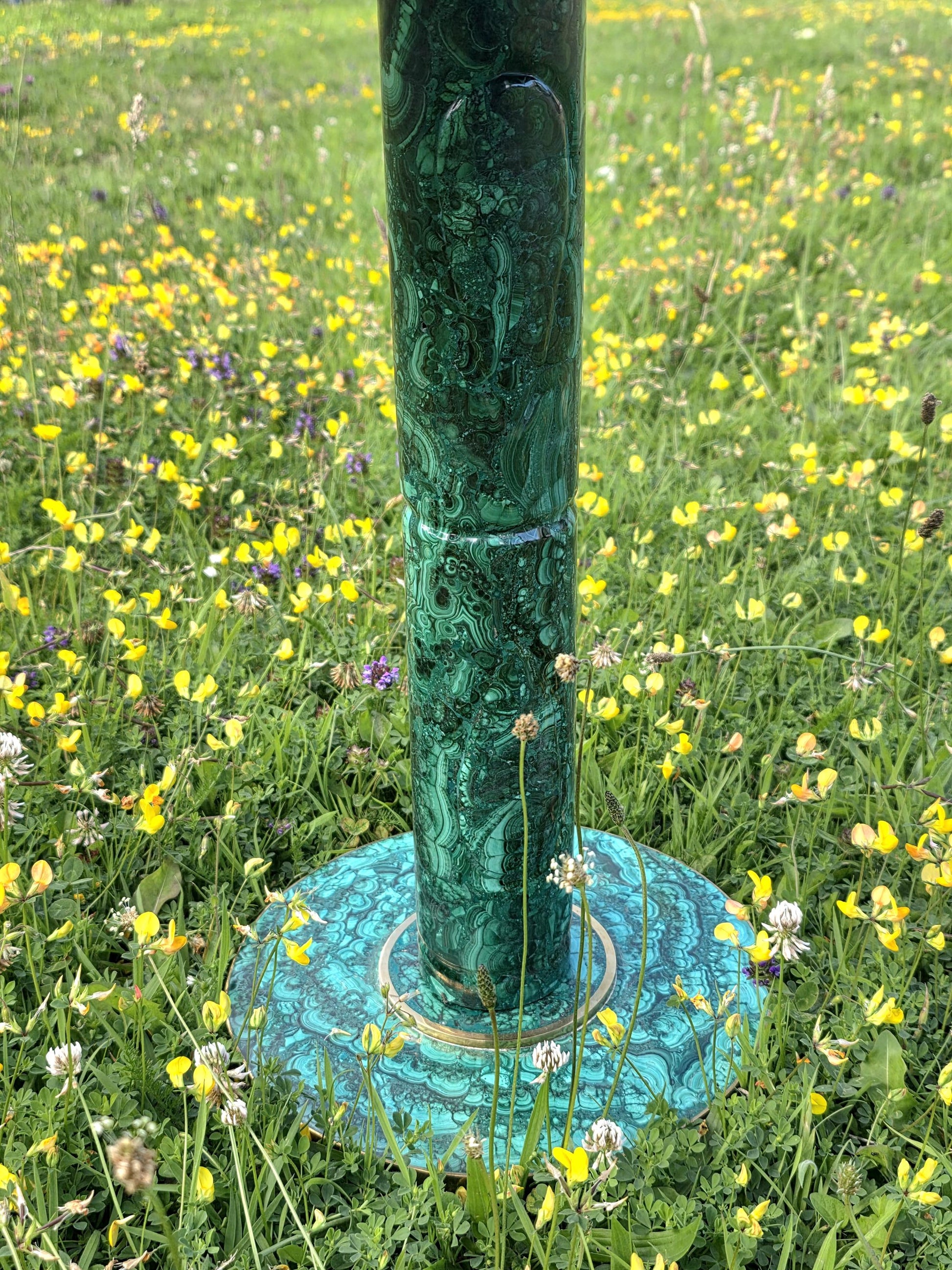 Green stone table made from authentic malachite, a bold decor piece for modern interiors.
