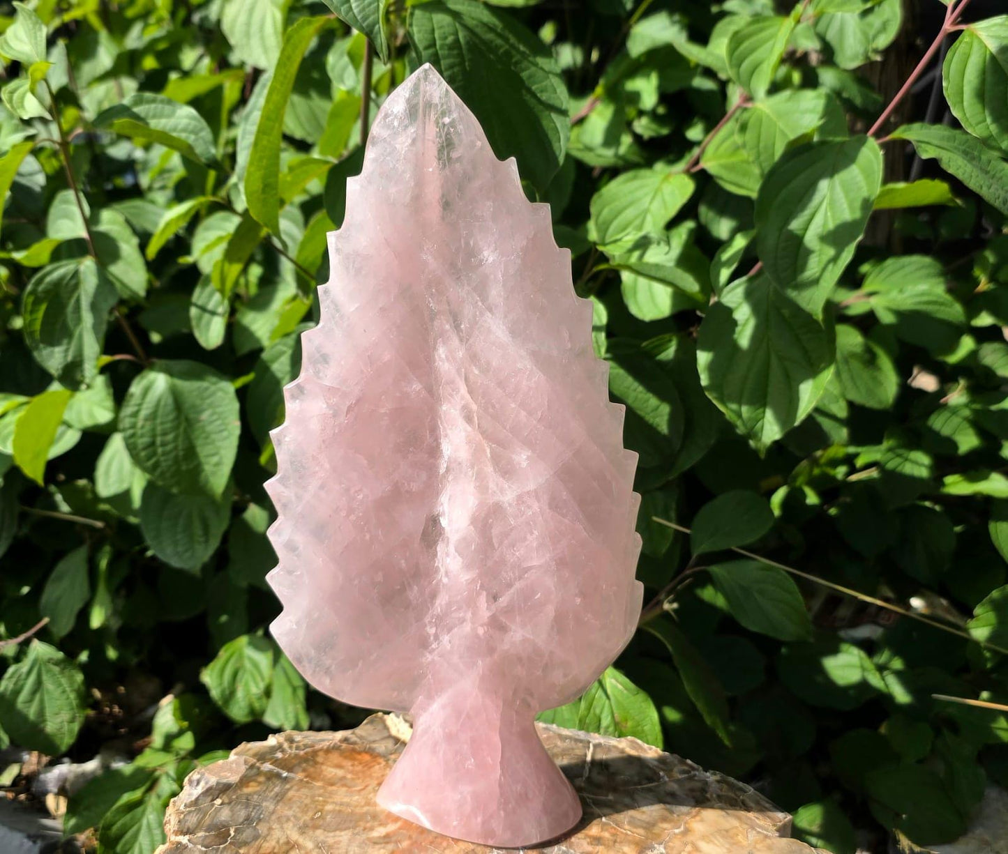 Hand-carved Madagascan Rose Quartz decorative sculpture.