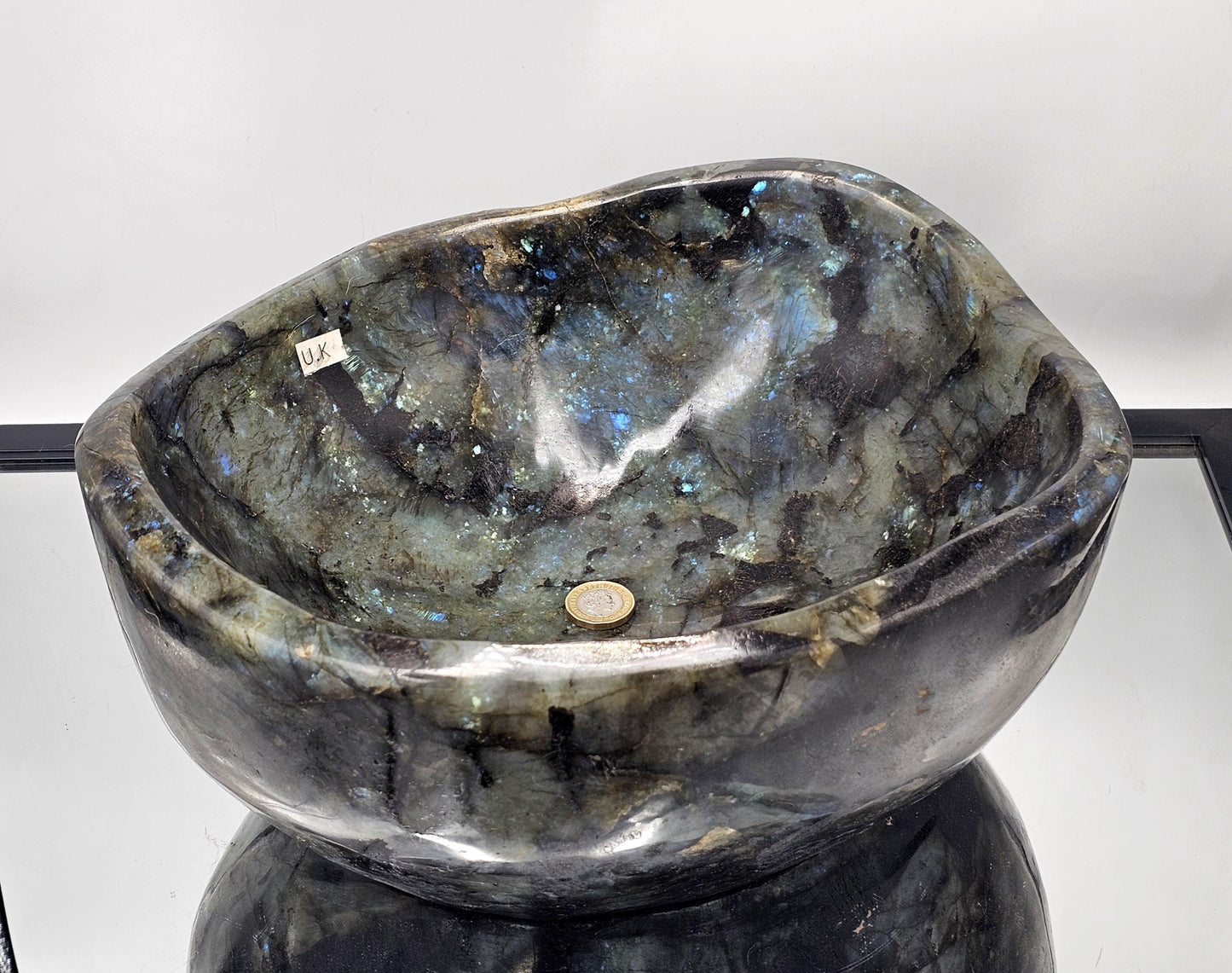 Hand-carved Labradorite Crystal Bowl, showcasing natural beauty and craftsmanship.