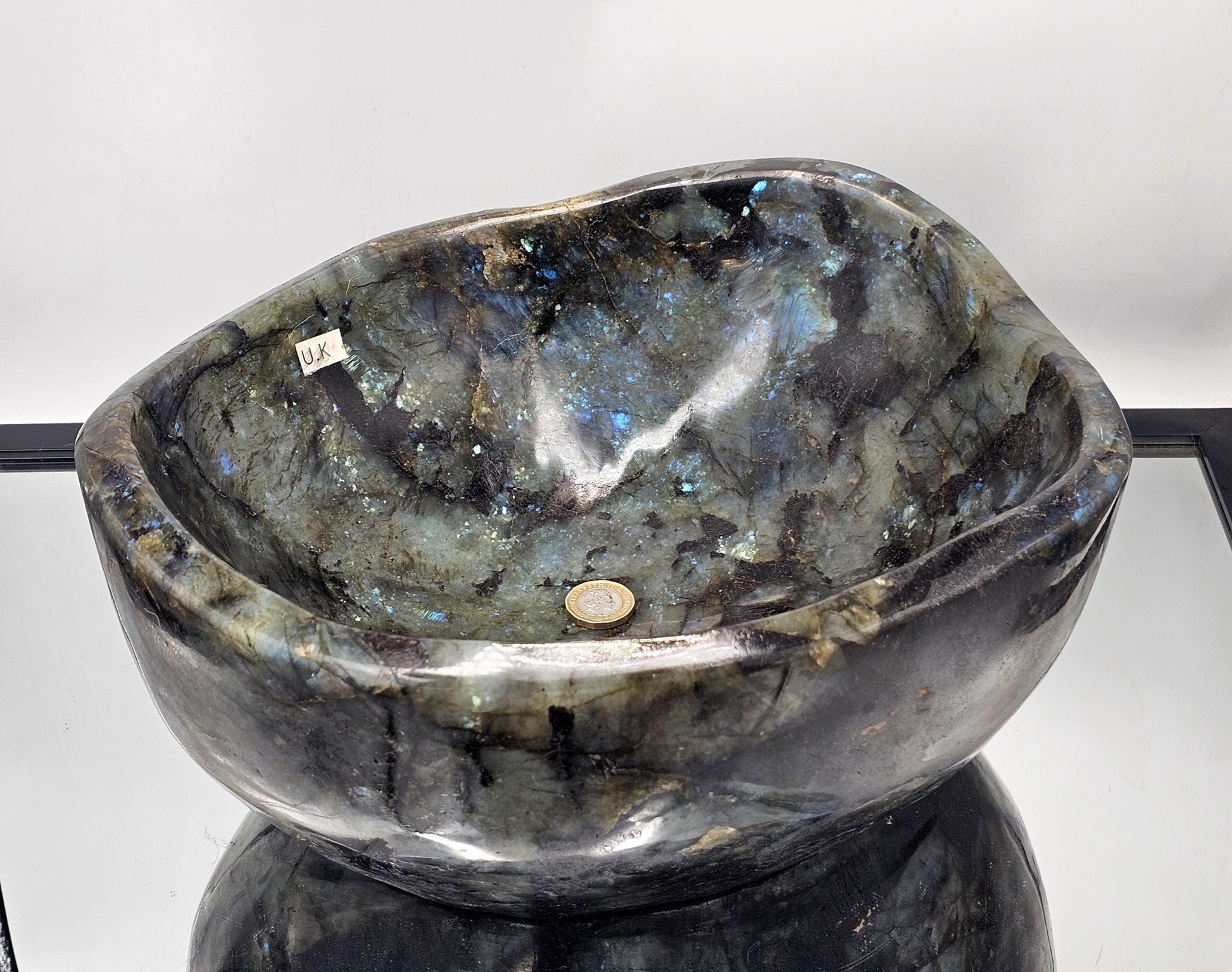 Hand-carved Labradorite Crystal Bowl, showcasing natural beauty and craftsmanship.
