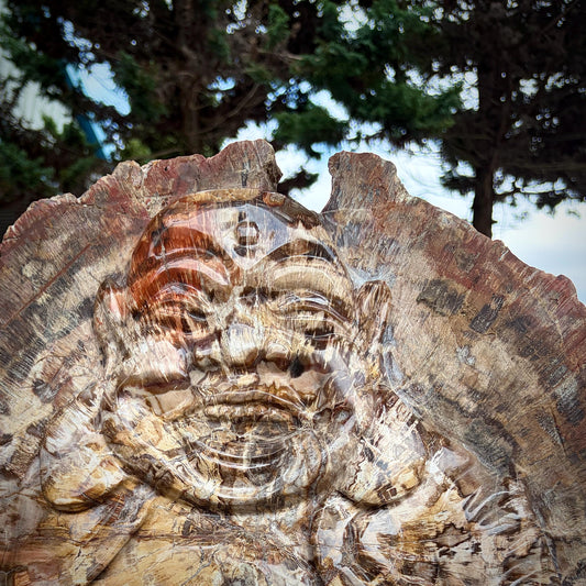 Natural fossil wood Laughing Buddha sculpture chosen by Distinction Crystals