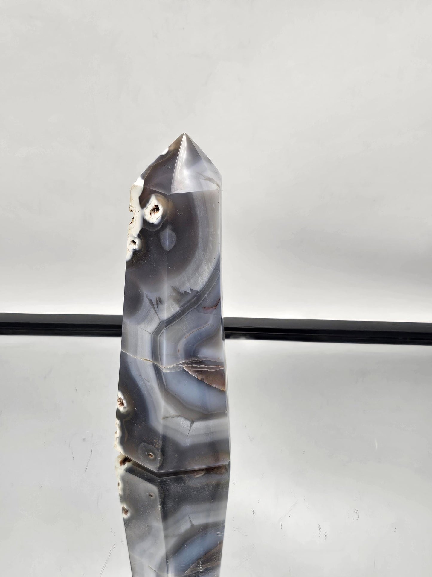 Hand-carved Orca Agate crystal point, perfect for spiritual balance.
