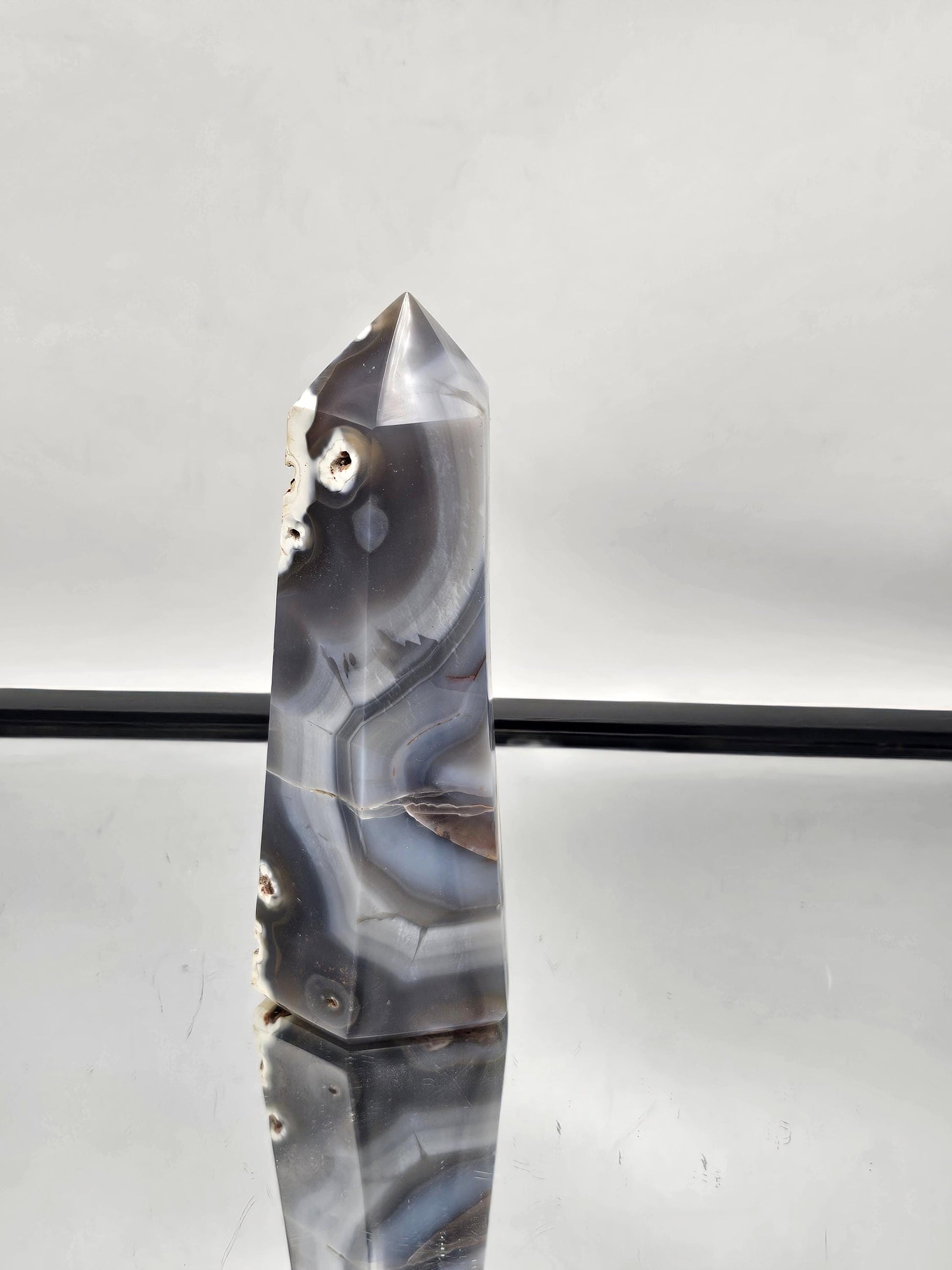 Hand-carved Orca Agate crystal point, perfect for spiritual balance.