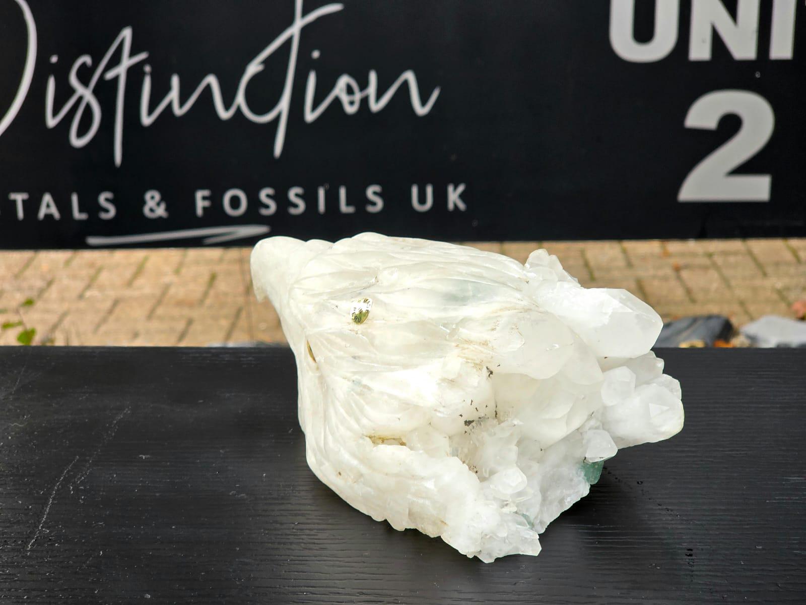 Hand-carved quartz eagle sculpture showcasing expert craftsmanship.