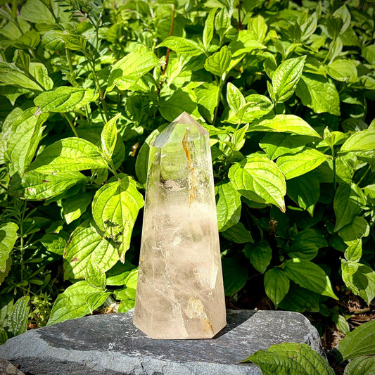 Hand carved quartz tower from Madagascar with polished faces and natural mineral detail.