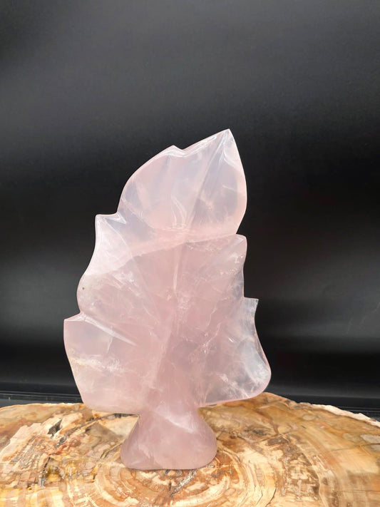 Hand-carved Rose Quartz crystal leaf sculpture with polished finish.