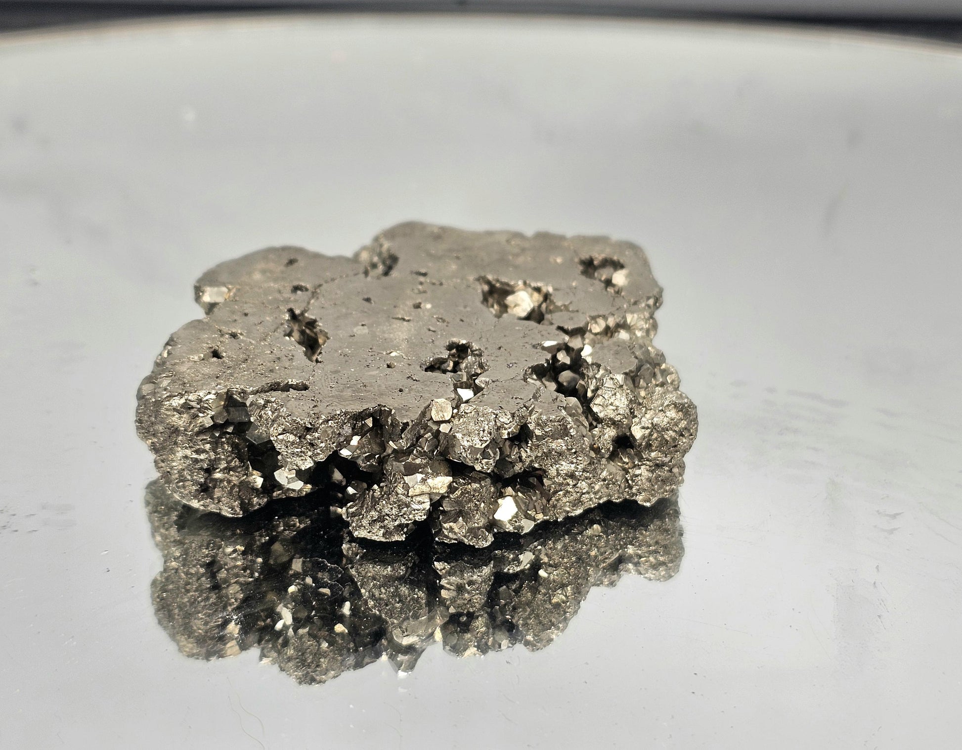 Hand-polished Pyrite slice, perfect for luxury home decor.