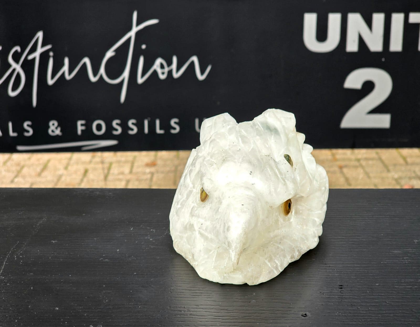 Handcrafted clear quartz eagle display piece with elegant design.