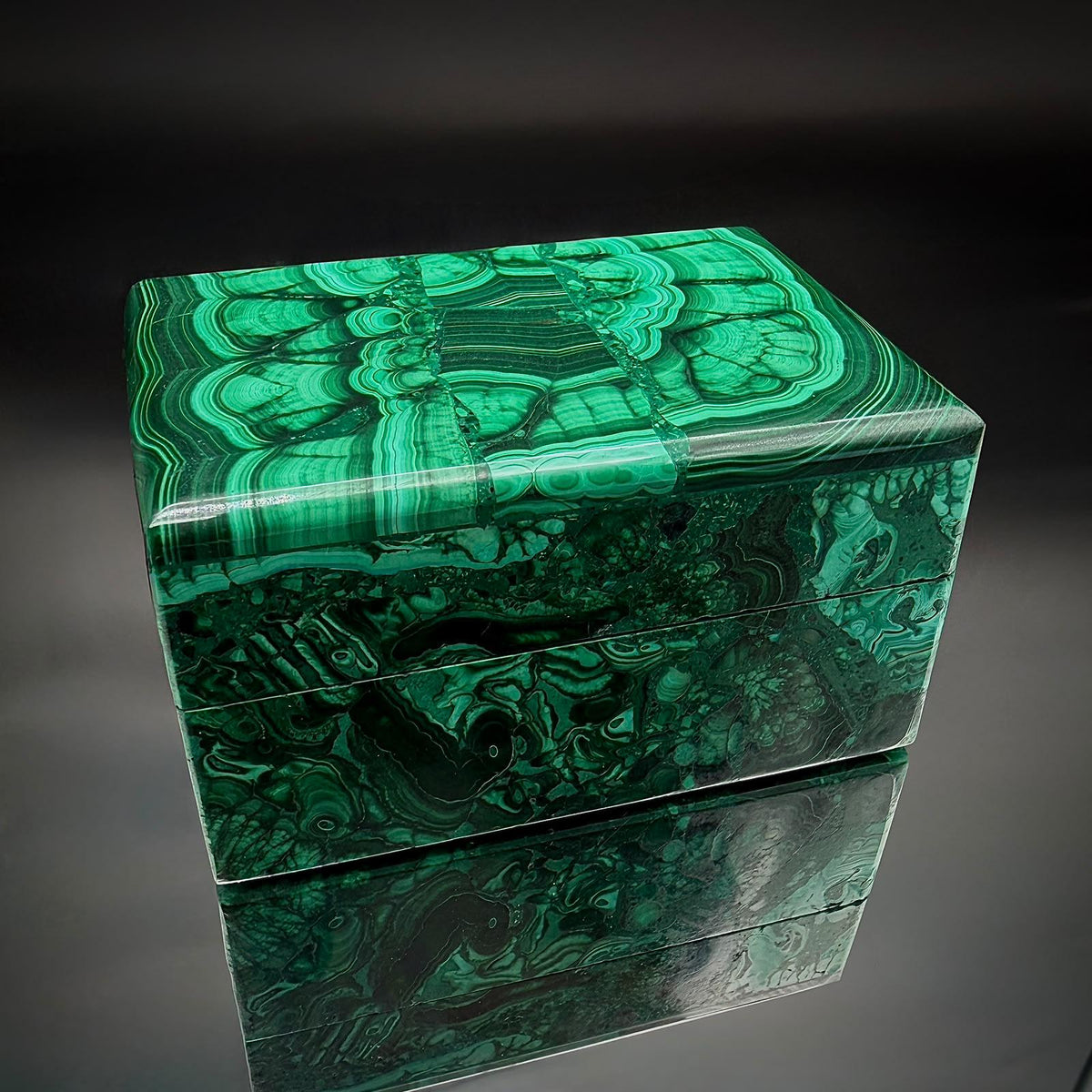 Handcrafted Malachite storage box photographed from an alternative angle showing its polished stone surfaces.